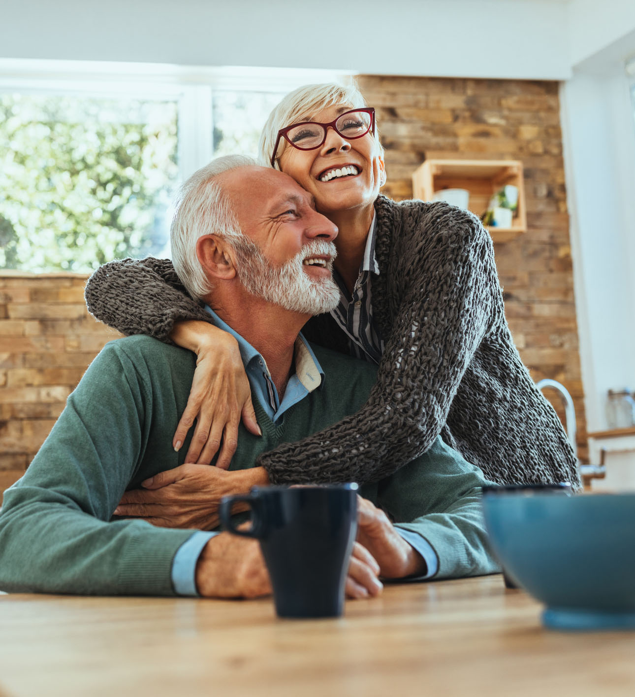 mature woman hugging her husband