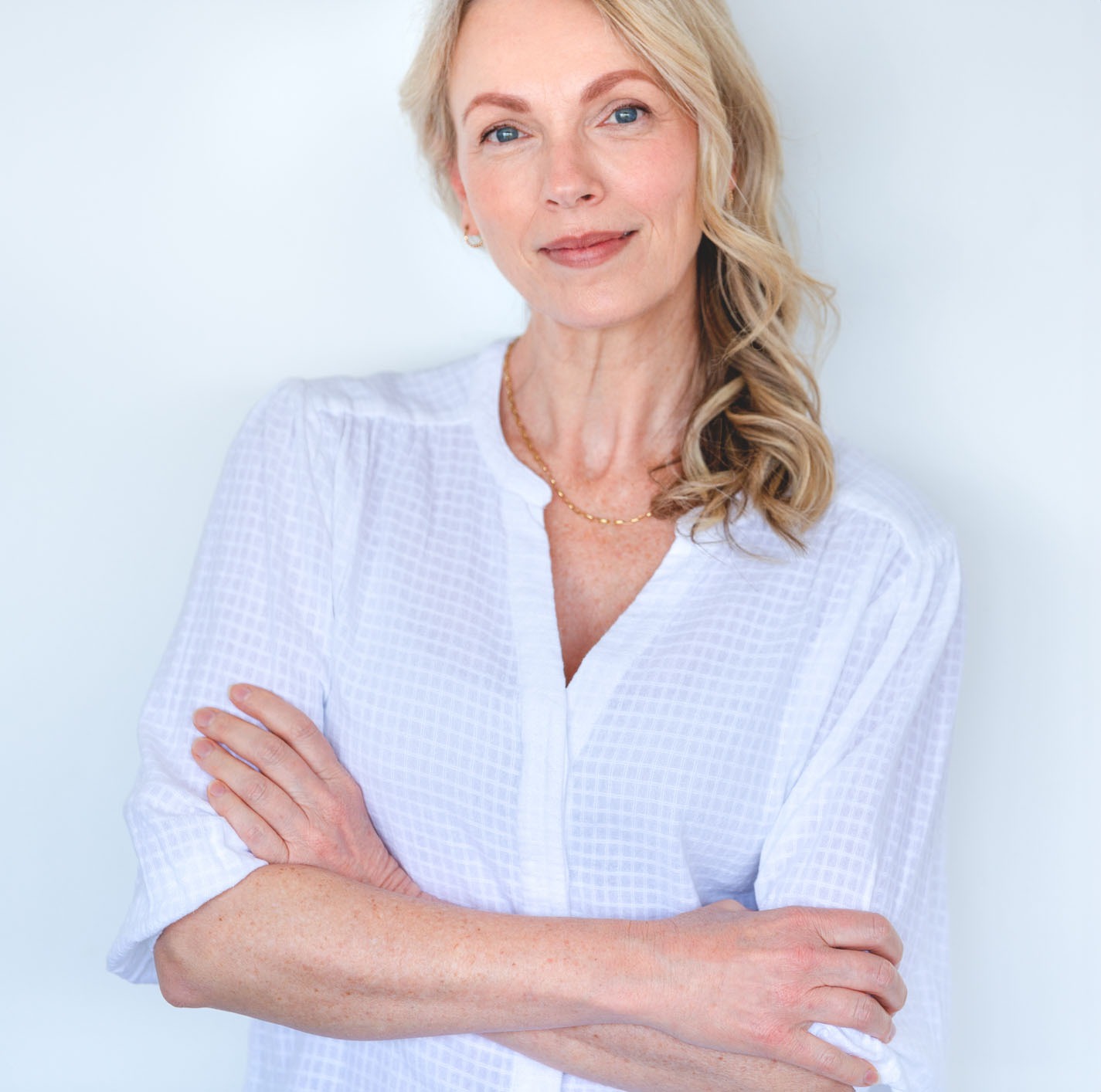 Attractive Mature woman looking strong and confident and relaxing and looking at the camera.