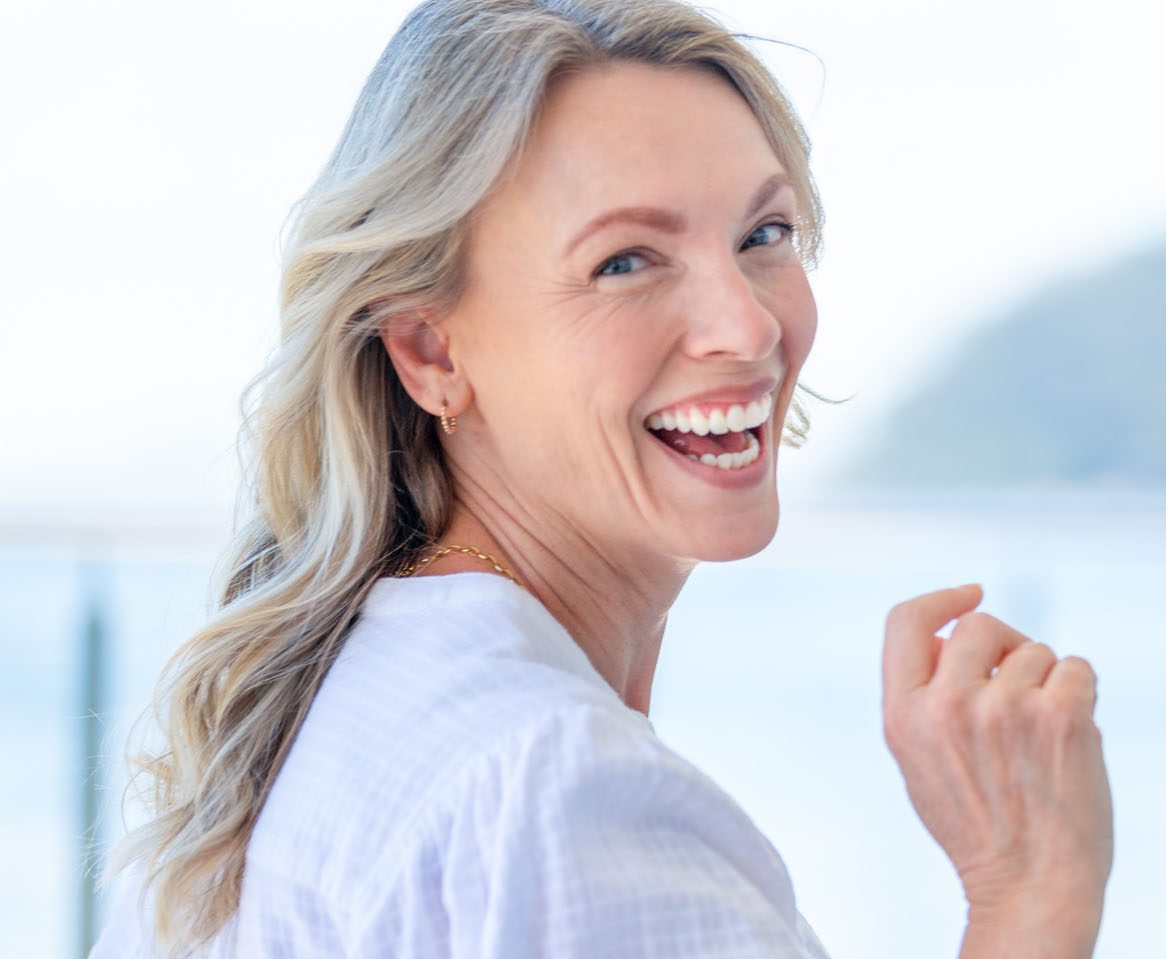 Beautiful mature woman portrait at waterfront house.